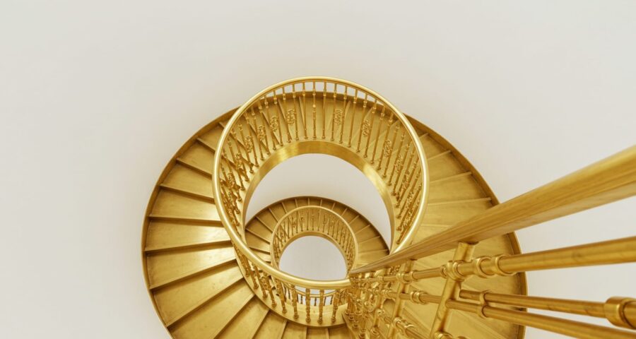 Photo-of-a-beautiful-golden-spiral-staircase-like-the-emotional-scale-for-alignment